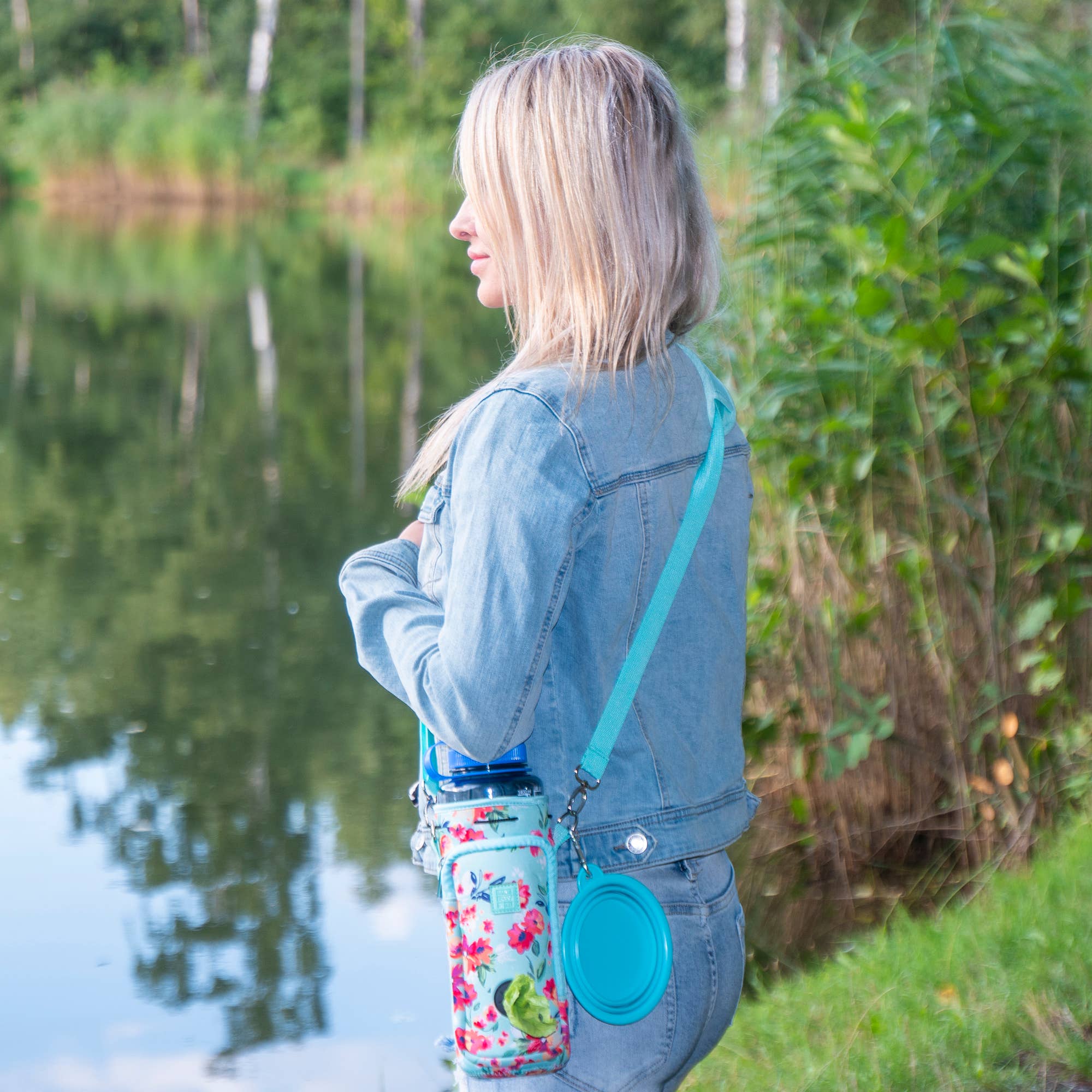 Teal Floral Hands-Free 32 oz Water Bottle Carrier with Dog Waste Bag Dispenser, Collapsible Pet Bowl & Storage Pocket